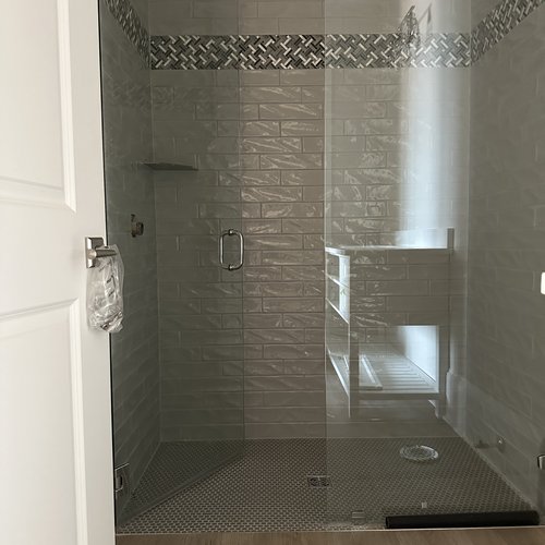 New floors and tiled shower in a bathroom by Marquis Floors in Lilburn, GA